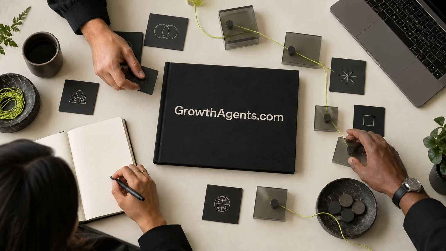 Growth operators arrange campaign materials around a GrowthAgents.com folio